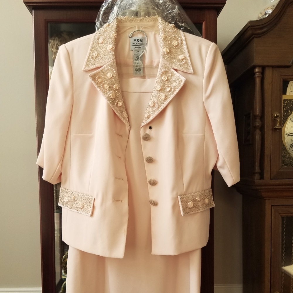 2 piece jacket and Long Skirt, light peachy pink in color.  There are 3 spots
